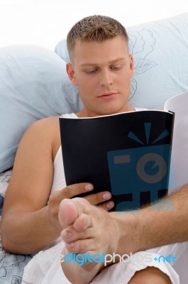 Resting Male Reading Report Stock Photo