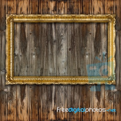 Retro Big Old Gold Picture Frame On Wood Wall Stock Photo