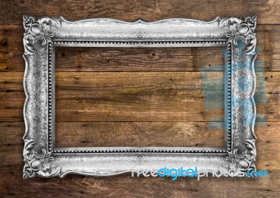 Retro Silver Gold Picture Frame On Wooden Wall Stock Photo