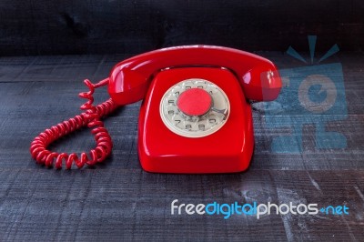 Retro Vintage Red Landline Unhang On Wooden Background Stock Photo