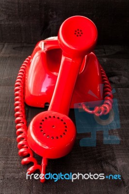 Retro Vintage Red Landline Unhang On Wooden Background Stock Photo