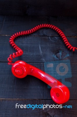 Retro Vintage Red Landline Unhang On Wooden Background Stock Photo