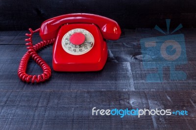 Retro Vintage Red Landline Unhang On Wooden Background Stock Photo