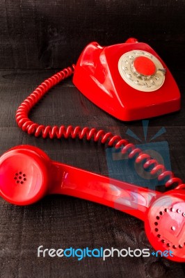 Retro Vintage Red Landline Unhang On Wooden Background Stock Photo