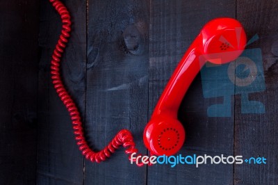 Retro Vintage Red Landline Unhang On Wooden Background Stock Photo