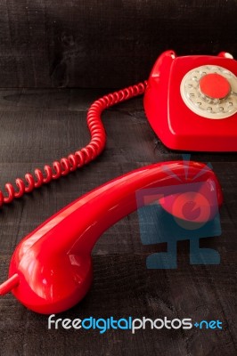 Retro Vintage Red Landline Unhang On Wooden Background Stock Photo