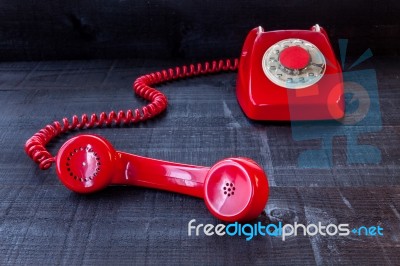 Retro Vintage Red Landline Unhang On Wooden Background Stock Photo