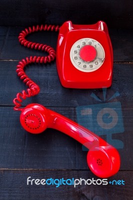 Retro Vintage Red Landline Unhang On Wooden Background Stock Photo