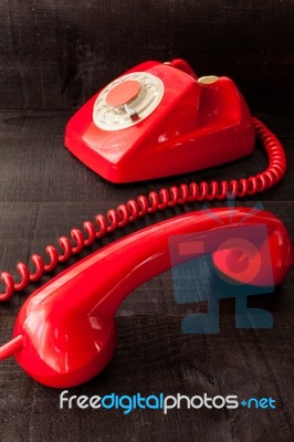 Retro Vintage Red Landline Unhang On Wooden Background Stock Photo