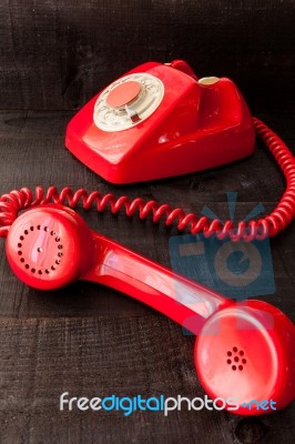 Retro Vintage Red Landline Unhang On Wooden Background Stock Photo