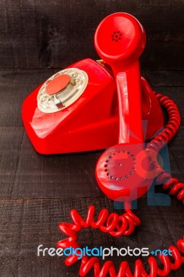 Retro Vintage Red Landline Unhang On Wooden Background Stock Photo