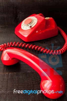 Retro Vintage Red Landline Unhang On Wooden Background Stock Photo