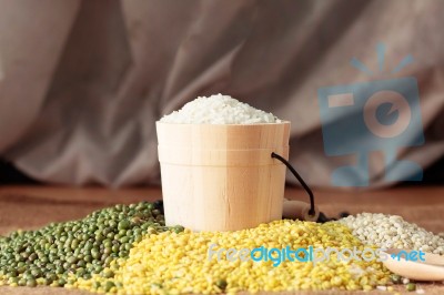 Rice And Nuts On Table Stock Photo