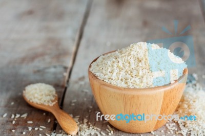 Rice Bowl On Wooden Stock Photo