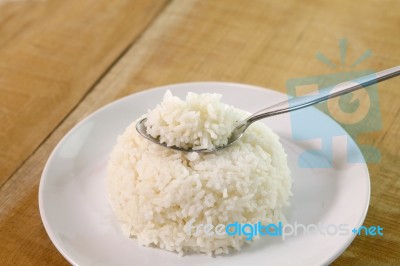 Rice On Spoon  Stock Photo