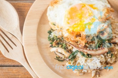 Rice Topped With Stir-fried Squid Basil And Fried Egg (thai Food) Stock Photo