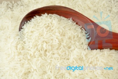 Rice With Wooden Ladle Stock Photo