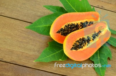 Ripe Papaya On Wood Background Stock Photo