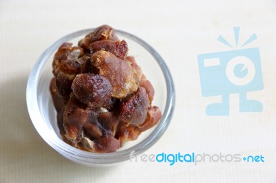 Ripe Tamarind In Bowl On Wood Background Stock Photo