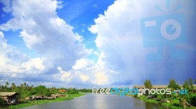 River With Cloudy Sky Stock Photo