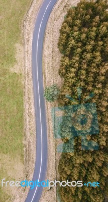 Road And Field In The Tasmanian Countryside Stock Photo