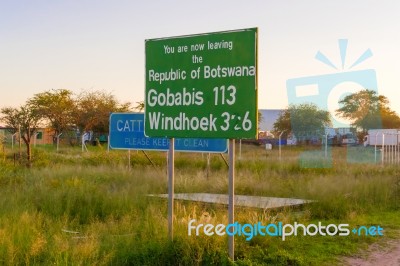 Road Signs On The Border Between Namibia And Botswana Stock Photo