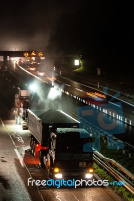 Road Works, Removal Of Old Asphalt Pavement At Night Stock Photo