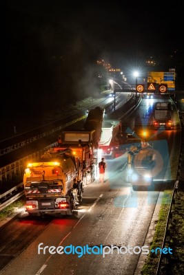 Road Works, Removal Of Old Asphalt Pavement At Night Stock Photo