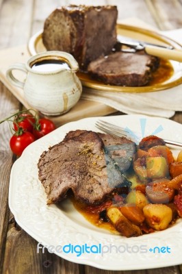 Roast Beef Joint With Roast Vegetables Stock Photo