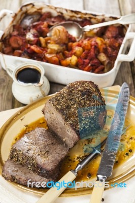 Roast Beef Joint With Roast Vegetables Stock Photo