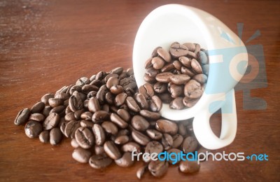 Roast Coffee Bean In White Mug Stock Photo