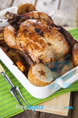 Roasted Chicken With Apples And Potatoes Stock Photo