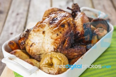 Roasted Chicken With Apples And Potatoes Stock Photo