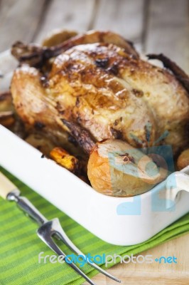 Roasted Chicken With Apples And Potatoes Stock Photo