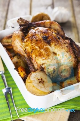 Roasted Chicken With Apples And Potatoes Stock Photo