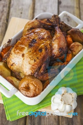 Roasted Chicken With Apples And Potatoes Stock Photo