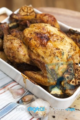 Roasted Chicken With Garlic And Potatoes Stock Photo