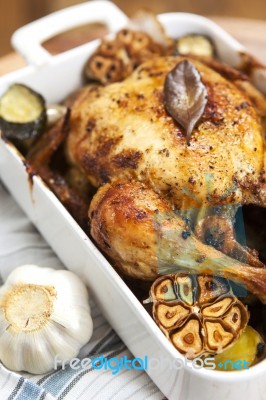 Roasted Chicken With Garlic And Potatoes Stock Photo