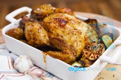 Roasted Chicken With Garlic And Potatoes Stock Photo