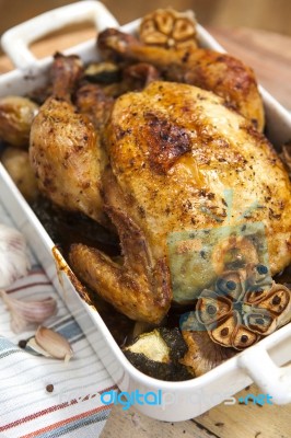 Roasted Chicken With Garlic And Potatoes Stock Photo