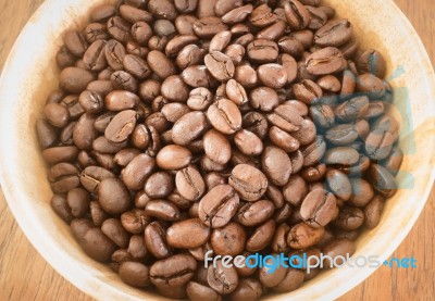 Roasted Coffee Bean In Bowl Stock Photo