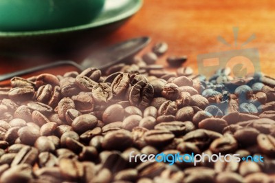 Roasted Coffee Beans And Cups Stock Photo