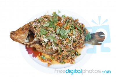 Roasted fish on plate Stock Photo