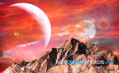 Rock Mountain With Red Sky And Twin Moons As Background Stock Image