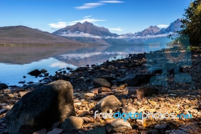 Rocks Along The Shore Of Lake Mcdonald Stock Photo