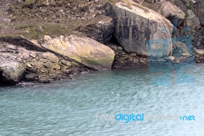 Rocks And Blue Water Near The Niagara Falls Stock Photo