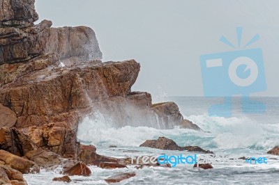 Rocks And The Ocean Waves Near Cape Point In  South Africa Stock Photo