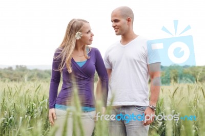 Romantic Walk By A Young Couple Stock Photo