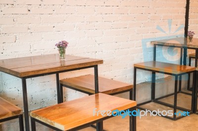 Room Interior White Brick Wall With Wooden Table Stock Photo