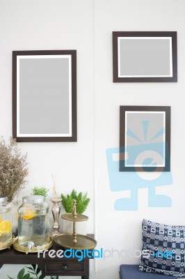 Room Interior With Frames On White Wall Stock Photo